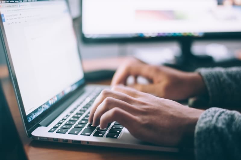 Job seeker browsing roles on a laptop